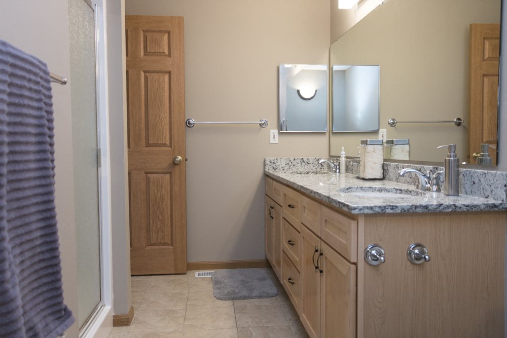 Granite countertops in bathroom with shower in master bath-Southwind Villas